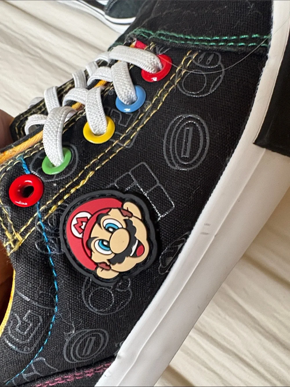 Nintendo Black Kids Sneakers with Multicolor Eyelets and Yellow Lining
